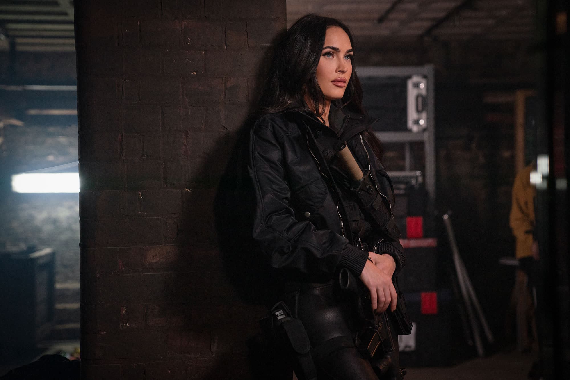 Megan Fox como Gina em Os Mercenários 4 personagem feminina em ação